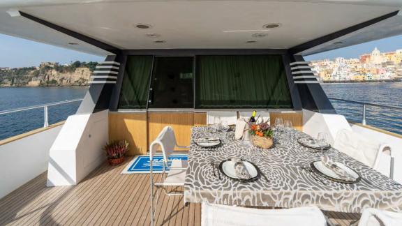 Experience a unique dining moment on Sandi IV with a luxury yacht rental in Italy.