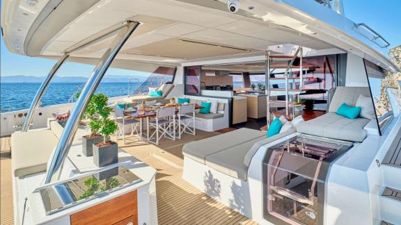 A spacious table with comfortable seating offers the perfect spot for enjoying meals against a stunning sea backdrop.