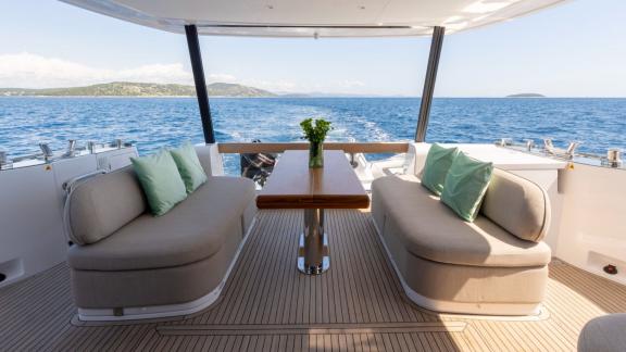 Stylish seating area on Olivia motor yacht’s aft deck near Šibenik, ideal for sea views.
