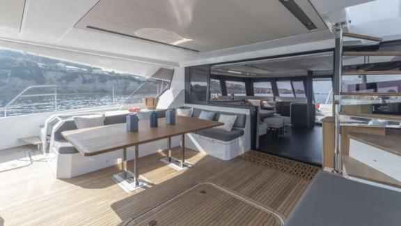 Allure catamaran for rent features spacious and shaded aft deck seating.