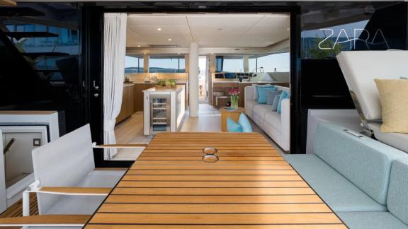In Kastela the aft deck of Zara opens into a bright saloon with kitchen and seating.