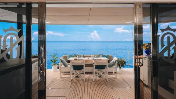 Experience serene meals on the aft deck of Sunreef 60 catamaran Sinata facing the open sea.