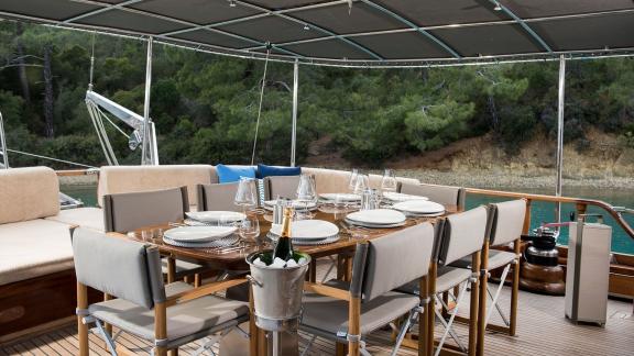 Elegant dining area on Serenad A with a set table.