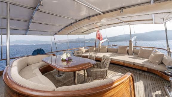 Dining and seating area on the aft deck of luxury gulet Lorient