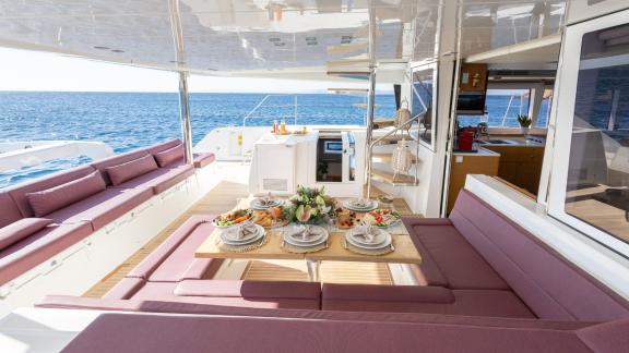 Elegantly set outdoor dining table on the King of Diamonds with direct sea view.