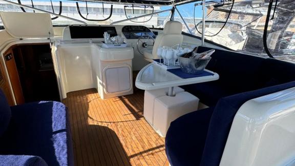 Experience luxury yacht rental in Naples and enjoy the stylish deck of Skins, creating unforgettable memories.