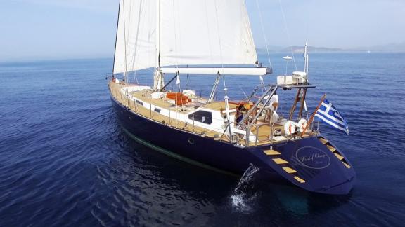 The luxury yacht Wind Of Change is sailing in the blue waters of Greece.