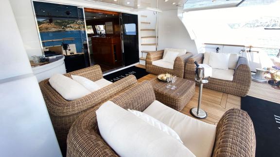 The aft deck of Paula 3 yacht features a stylish and comfortable seating area.