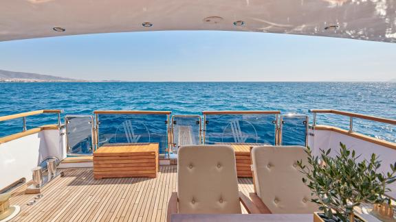 Relaxation area on the aft deck of the motor yacht Wide Liberty with endless sea views.