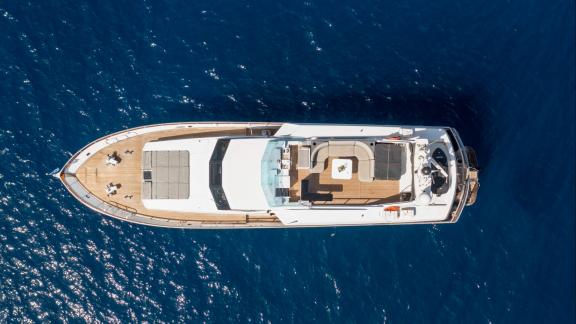 Shiva features a spacious deck for daily motor yacht charters and VIP boat tours in Mykonos.