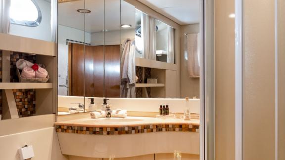 Shiva features a modern guest bathroom for weekly motor yacht charters and comfortable yacht holidays in Mykonos.
