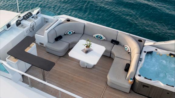 Shiva features a flybridge seating area for daily motor yacht charters and VIP sea escapes in Mykonos.
