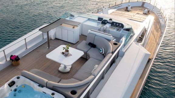 Shiva features a flybridge lounge for daily motor yacht charters and luxury island tours in Mykonos.
