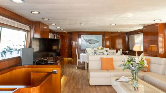 Shiva features a luxury main salon for daily motor yacht charters and premium sea holidays in Mykonos.