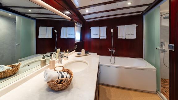 In Göcek gulet charter option Always Smile bathroom with bathtub shower sink and spacious layout visible.