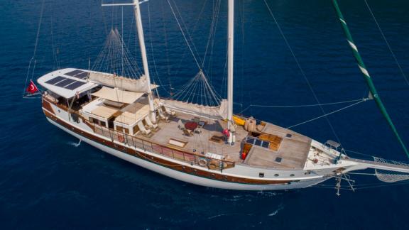 Bird's eye view of the sailing boat Amazon Solo in Turkey, surrounded by blue water.