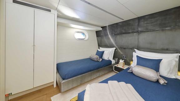 The twin-bed guest cabin on the motor yacht Anavi offers comfortable accommodation with modern touches.