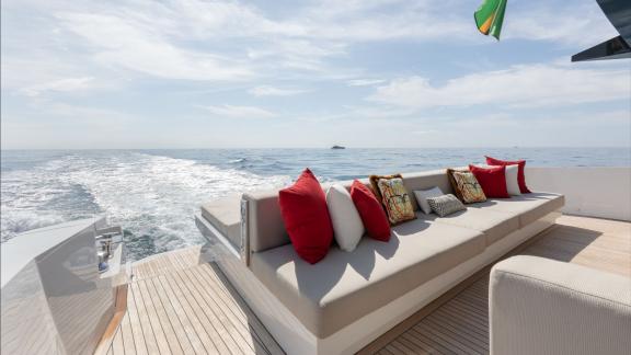 Lady Luck Arcadia Sherpa 80XL offers a colorful cushioned lounge on the aft deck at sea.