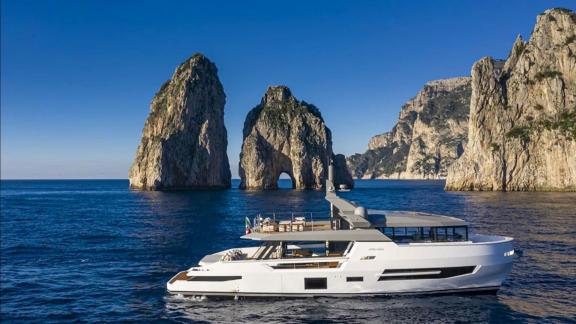 Lady Luck Arcadia Sherpa 80XL sails through stunning rock formations in luxury style.