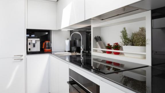 The sleek galley blends functionality and style, perfect for creating delightful onboard moments.