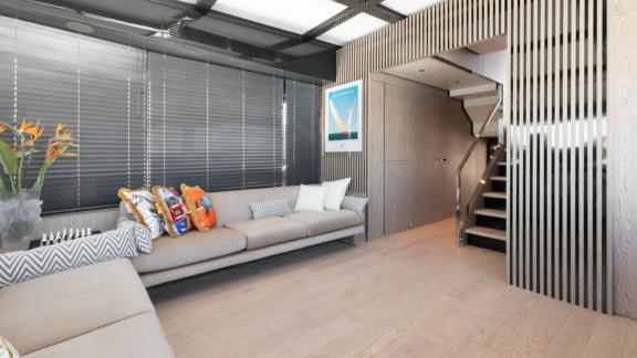 The lounge combines sleek design and cozy seating, offering a luxurious and airy ambiance.