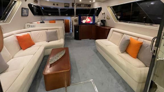 Comfortable seating area with TV in the salon of motor yacht Ayşe Sultan 1.