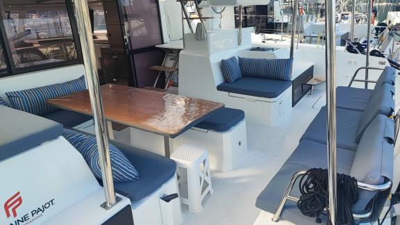 The aft deck of the Reina 1 catamaran features spacious and comfortable seating areas.