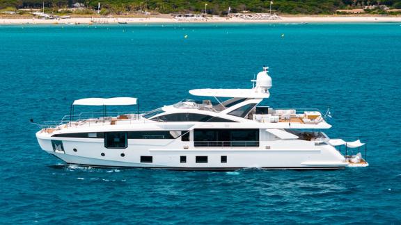 Nemesis cruises near Mallorca. Upper deck offers spacious sunbathing and seating areas. Perfect for yacht rental.