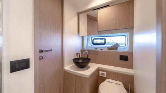 In Sibenik motor yacht charter option Nalu bathroom with modern sink and compact design offering practical and comfortab
