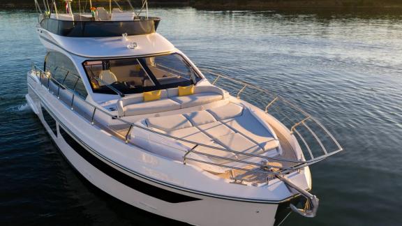 In Sibenik motor yacht charter option Nalu foredeck with sunbeds and sea view offering relaxing comfort visible.