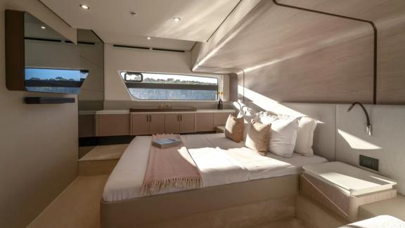 In Sibenik motor yacht charter option Nalu cabin with large bed and modern interior offering comfortable and relaxing st