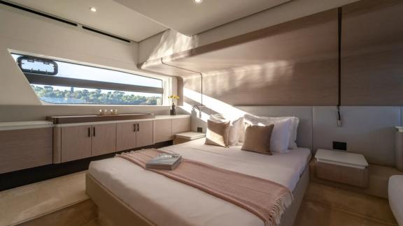 In Sibenik motor yacht charter option Nalu cabin with large bed and sea view offering comfortable stay visible.