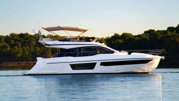 In Sibenik motor yacht charter option Nalu cruising on calm waters with modern design offering comfortable blue cruise e