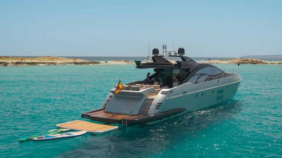 Anchored in Ibiza, The Jungle features a swim platform and water toys for luxury yacht charter holidays.