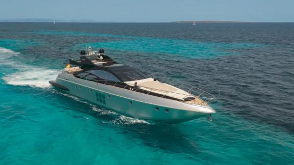 The Jungle is seen cruising off Ibiza, showcasing its sleek profile across turquoise waters.