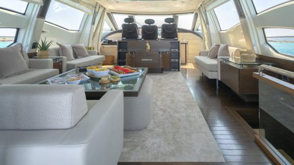 The Jungle motor yacht is anchored in Ibiza, featuring an elegant salon and panoramic helm station.