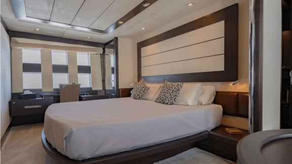The master cabin of The Jungle in Ibiza features a large bed and a dedicated workspace area.