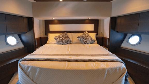 The guest cabin of The Jungle in Ibiza features a double bed and side windows with natural light.