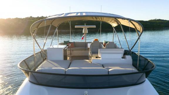 In Sibenik motor yacht charter option Nalu upper deck with seating and sea view offering relaxing atmosphere visible.