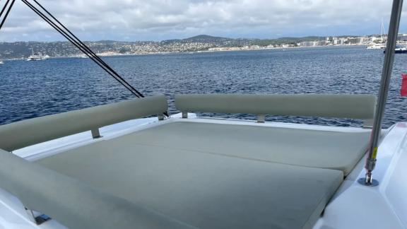 Relax on the comfy sunbed located on the flybridge of Bali 4.2 Christeol catamaran while enjoying the sea.