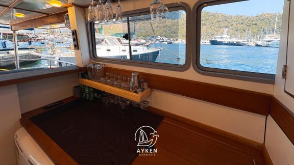 The bar area inside Gulet Ayken provides an ideal space for preparing drinks during the journey.