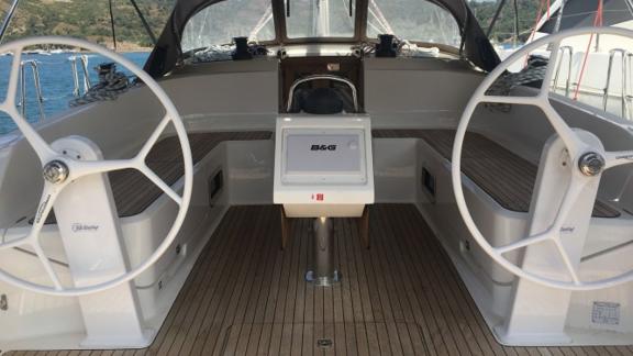 Spacious cockpit of the sailing yacht Santiago equipped with dual steering wheels.