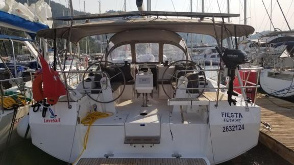 The aft deck of the sailboat Fiesta, moored in the marina.