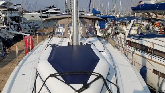 The foredeck of the sailboat Fiesta, moored in the marina.