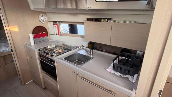 The kitchen area of Triton 89 sailing yacht provides all the necessary amenities for cooking and preparation.