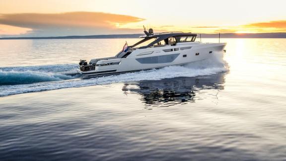 Motor yacht Kimani Bluegame BG74 glides across the Adriatic with elegance and power at golden hour.