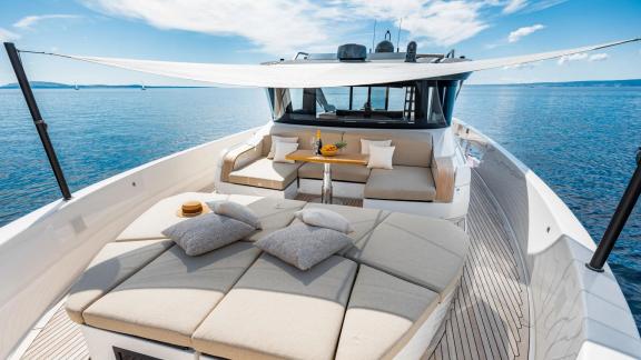 Kimani BG74 motor yacht offers a foredeck with sunbeds and lounge space.