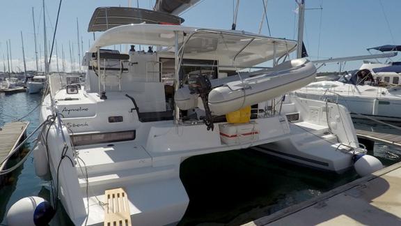 The Aymeline catamaran in Šibenik port, ready for the next sailing trip with a tender on board.