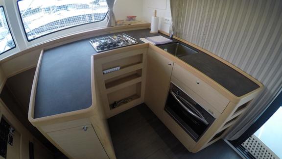 Well-equipped kitchen in the Aymeline catamaran, perfect for preparing meals at sea.