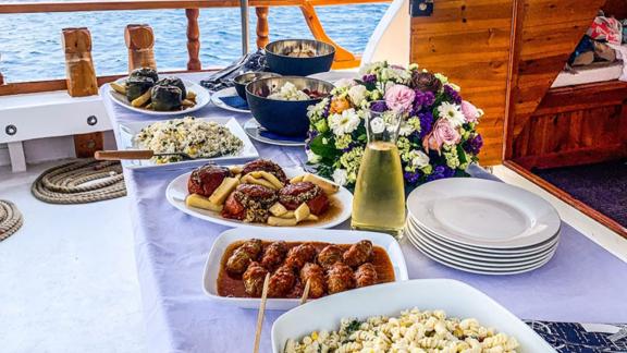 Savor a delicious onboard lunch during your daily cruise on Alexia K while enjoying sea views.